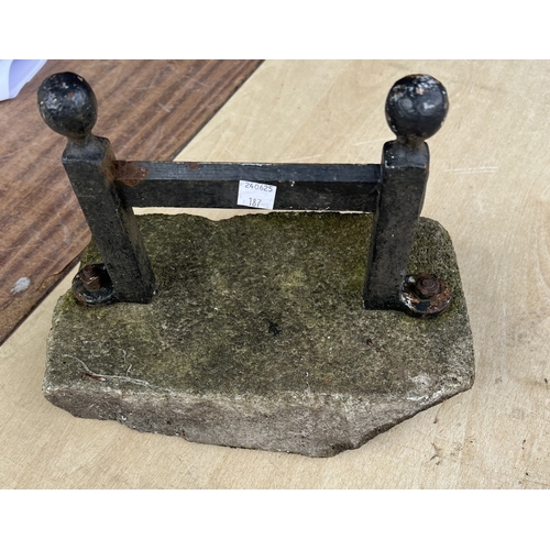 187 - A vintage cast iron door stop in the form of a riding boot; a boot scraper.