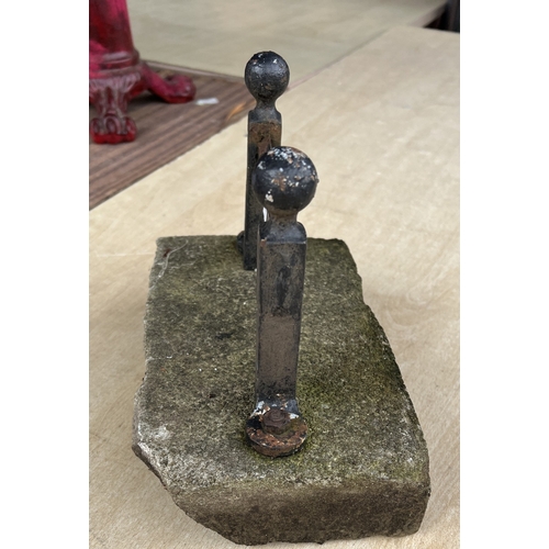187 - A vintage cast iron door stop in the form of a riding boot; a boot scraper.