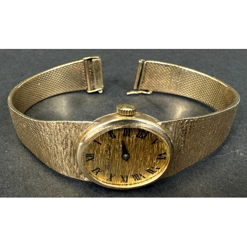 603 - A Bueche-Girod lady's 9ct hallmarked gold wristwatch on 9ct hallmarked gold bark-effect strap (gross... 