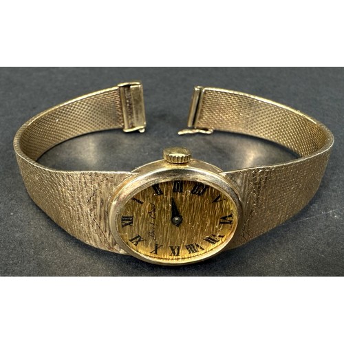 603 - A Bueche-Girod lady's 9ct hallmarked gold wristwatch on 9ct hallmarked gold bark-effect strap (gross... 