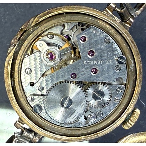 602 - An early 20th century lady's wristwatch on expanding bracelet, back plate 9ct hallmarked gold (weigh... 