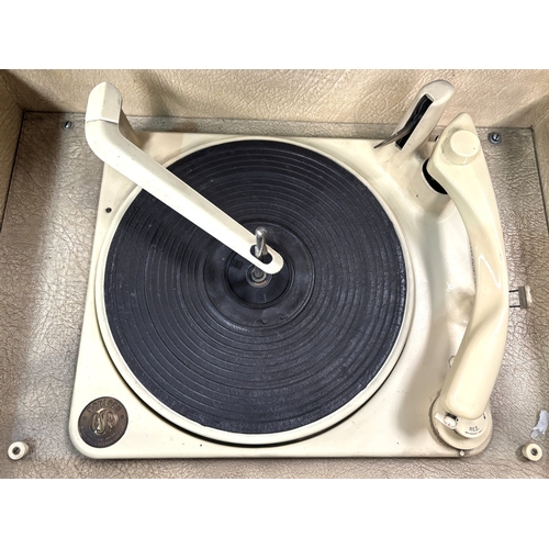 84 - A mid 20th century walnut table top radio with record player; a mahogany circular wall clock.