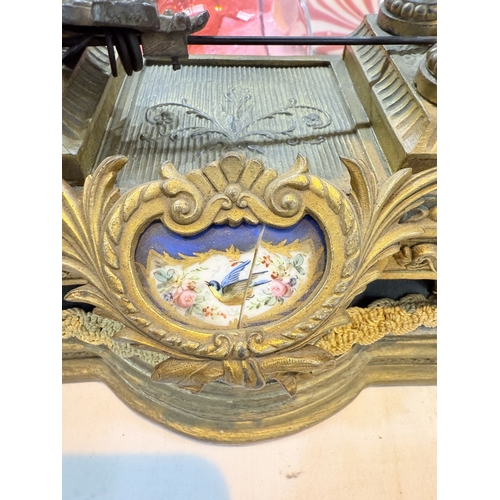 94A - A 19th century Louis XVI style ormolu  and porcelain mantle clock with vase finial, drum shaped cloc... 
