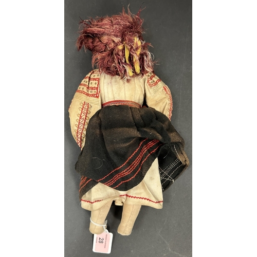 28 - An early/mid 20th century doll in embroidered European peasant dress, height 31cm.