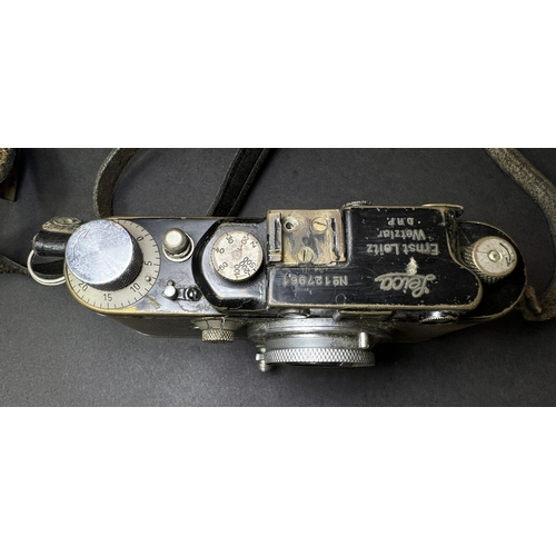 4 - A LEICA 35mm camera with 50mm lens and 35mm lens, serial number. 654440 (poor condition)NB: descript... 