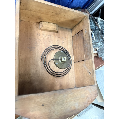 84 - A mid 20th century walnut table top radio with record player; a mahogany circular wall clock.