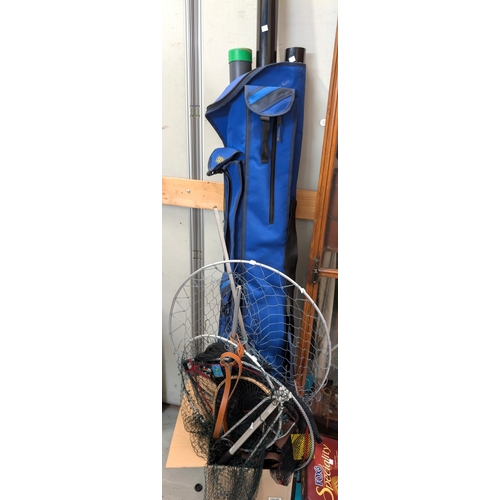 37 - A bag with fishing rods in tubes, various large fishing nets (wood and metal), and a shooting stick....