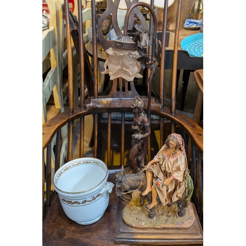 38 - A bronze effect lamp of in the form of a lady, planter and stoneware figure of woman...