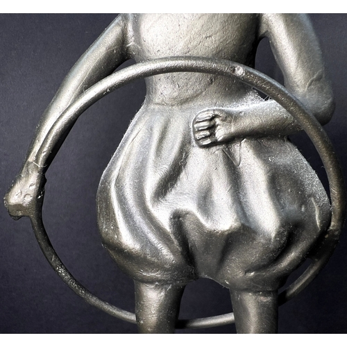 31 - An Art Deco bronzed figure depicting a girl with a hoop, on a two-tier marble stand, height 20cm....