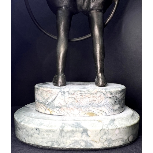 31 - An Art Deco bronzed figure depicting a girl with a hoop, on a two-tier marble stand, height 20cm....