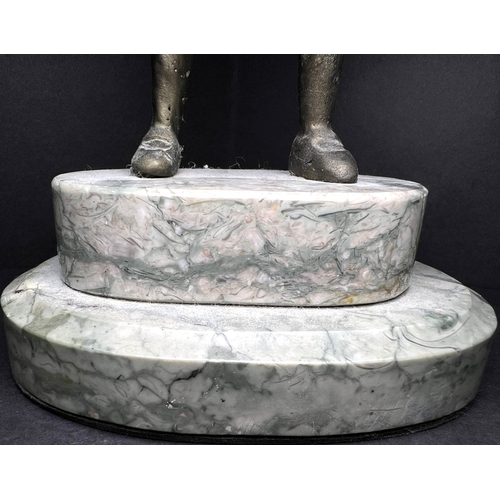 31 - An Art Deco bronzed figure depicting a girl with a hoop, on a two-tier marble stand, height 20cm....