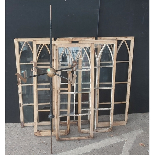26 - A large cast iron weather vane and three pairs of arched wood framed windows (a.f)...