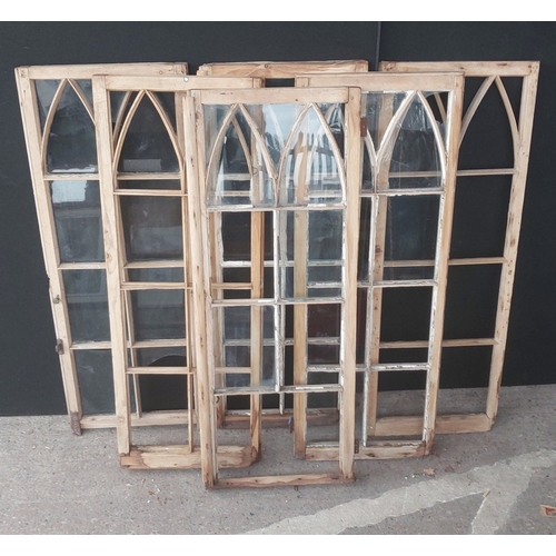 26 - A large cast iron weather vane and three pairs of arched wood framed windows (a.f)...