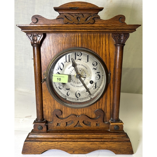 22A - 8 Day Fattorini alarm clock in oak case, silvered dial, with key, circa 1909....