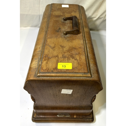 13 - A hand operated sewing machine....