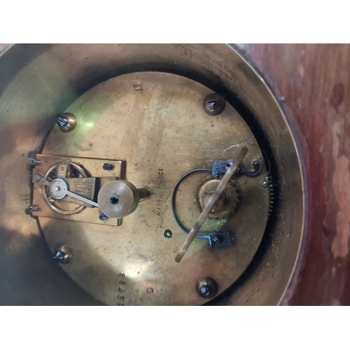 19 - Edwardian mantle clock with inlaid decoration.<br />No bids sold with next lot...