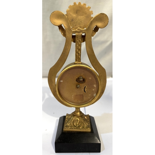 22 - A French gilt ormalou clock in the shape of a harp...