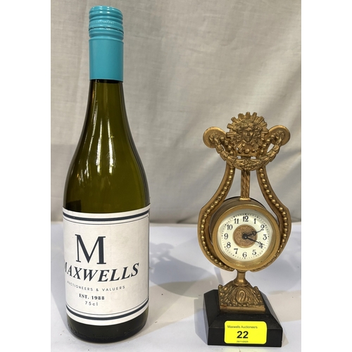 22 - A French gilt ormalou clock in the shape of a harp...