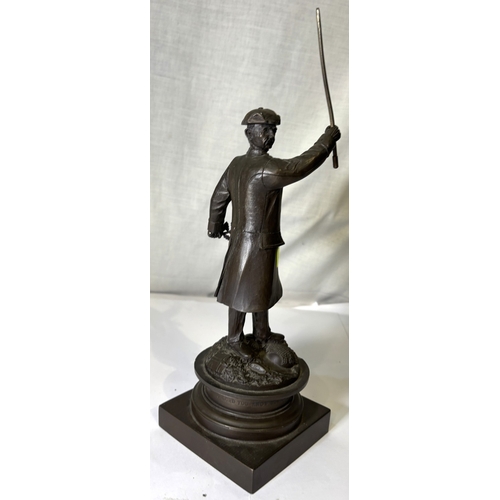 23 - Bronzed sculpture of a historical figure with inscription 