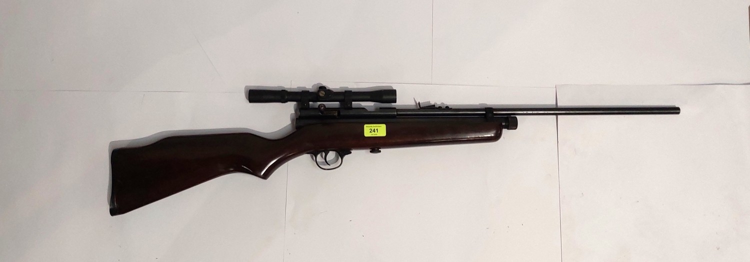 QB78 C02 powered air rifle with bolt action and scope.