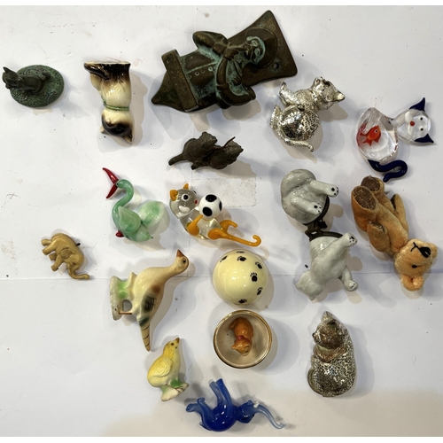 25 - A brass Rippon door knocker in the form of man blowing horn, 9cm; a Christofle plated cat; a Limoges...