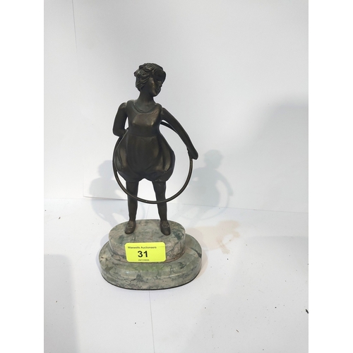 31 - An Art Deco bronzed figure depicting a girl with a hoop, on a two-tier marble stand, height 20cm....
