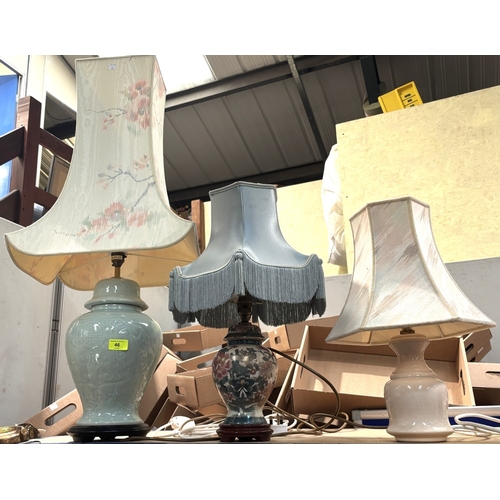 46 - A large Celadon baluster table lamp and two others; an ornate gilt wall mirror...