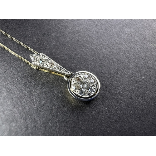 A white metal necklace with circular drop set diamond chips on very ...