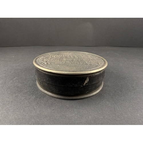A modern bronze coloured metal circular snuff box with French military ...