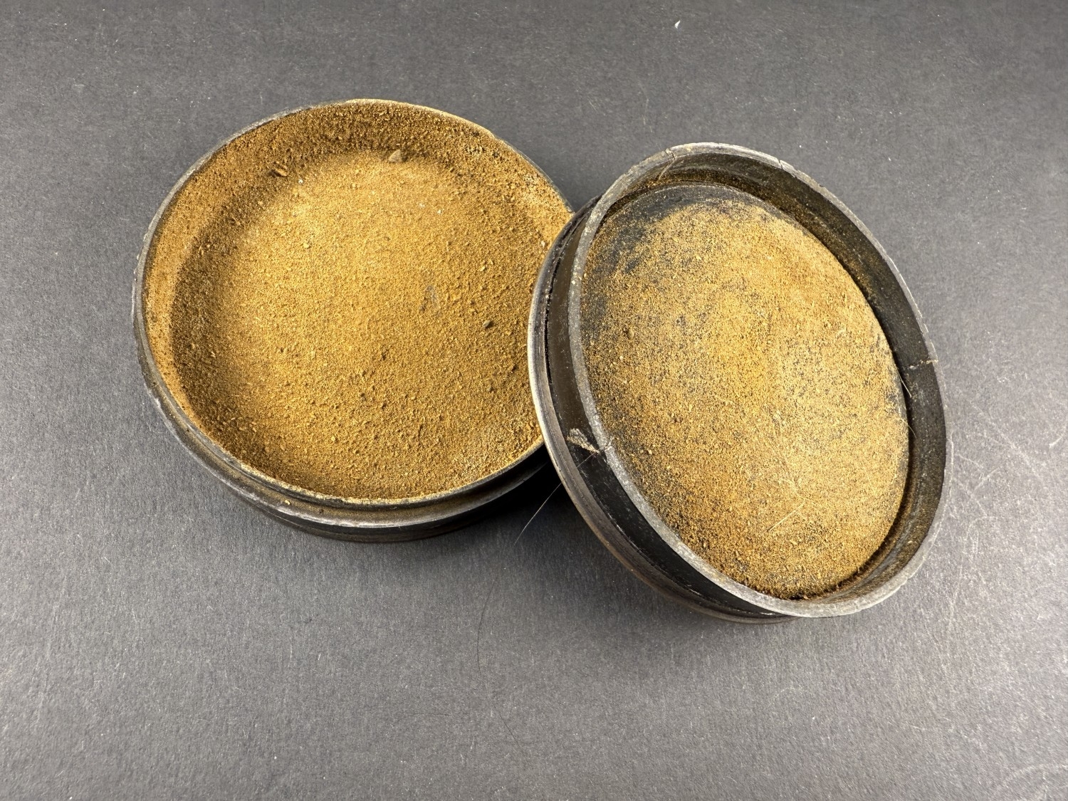 A modern bronze coloured metal circular snuff box with French military ...