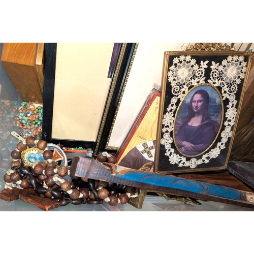 17 - A collection of rosary bead necklaces, religious icons panels, brass crucifix etc....