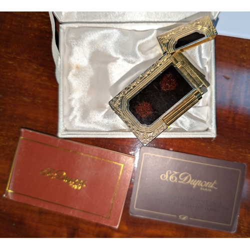 18A - A Dupont lighter with associated booklet...