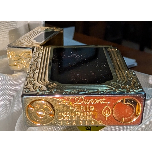 18A - A Dupont lighter with associated booklet...
