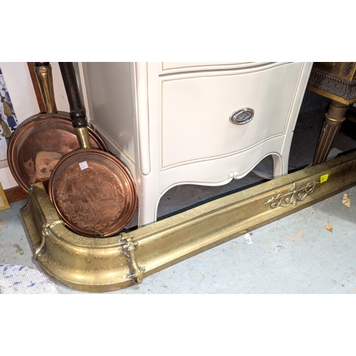 35 - An Edwardian ornate brass fender; a six-branch brass centre-light fitting....