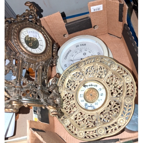 46A - A brass wall clock, pierced surround and 3 other clocks.<br />No bids sold with lot 46b...