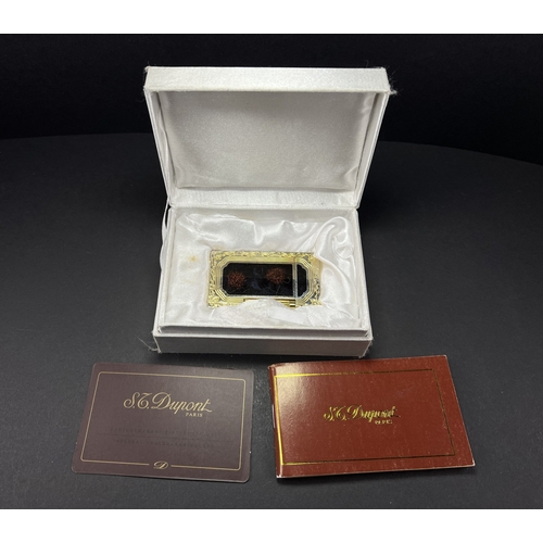 18A - A Dupont lighter with associated booklet...