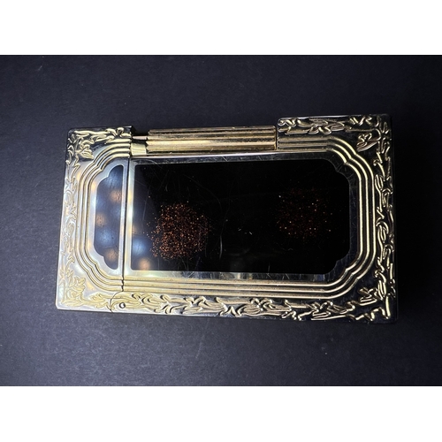 18A - A Dupont lighter with associated booklet...