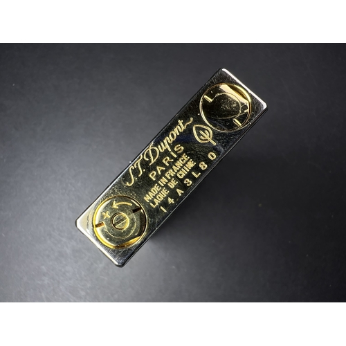 18A - A Dupont lighter with associated booklet...