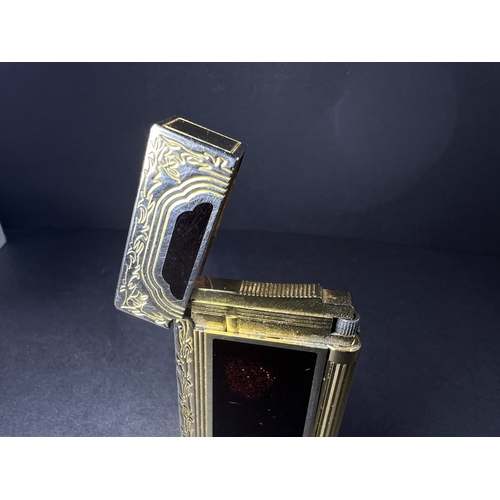 18A - A Dupont lighter with associated booklet...