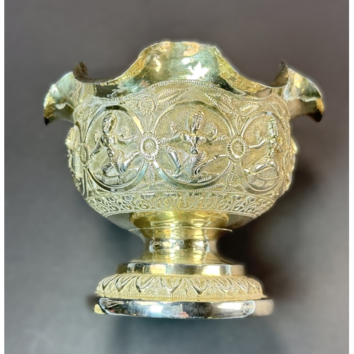764 - An early 20th century Indian white metal pedestal bowl with wavy rim, embossed figural decoration, 4... 