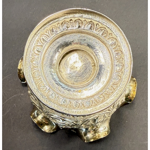 764 - An early 20th century Indian white metal pedestal bowl with wavy rim, embossed figural decoration, 4... 