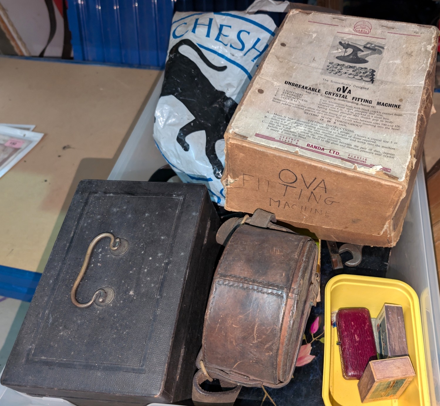 An OVA Fitting machine and a selection of clock tools and parts. etc