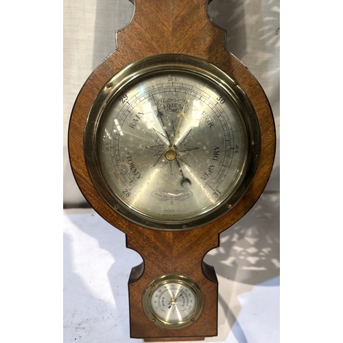 77 - A brass two height stand, brass coal bucket, brass door stop and a Comitti aneroid barometer.