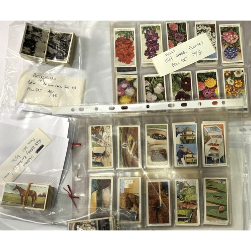 226A - A collection of cigarette cards with Wills card album including Players 1928 Products of the World 5... 