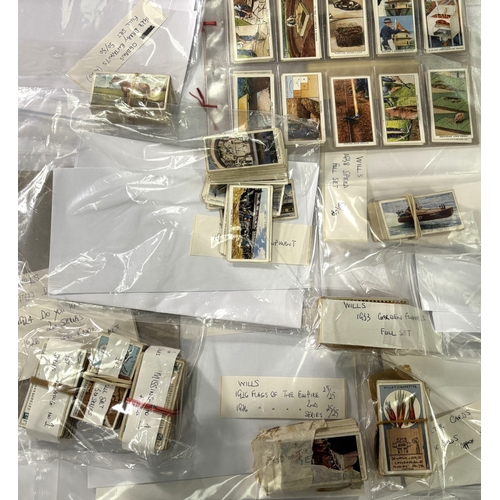 226A - A collection of cigarette cards with Wills card album including Players 1928 Products of the World 5... 