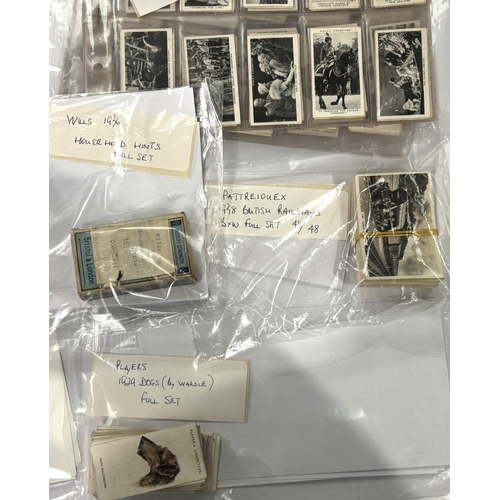226A - A collection of cigarette cards with Wills card album including Players 1928 Products of the World 5... 
