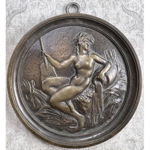 23 - A late 19th /early 20th century bronze plaque depicting a bird on a branch in relief with berries an... 