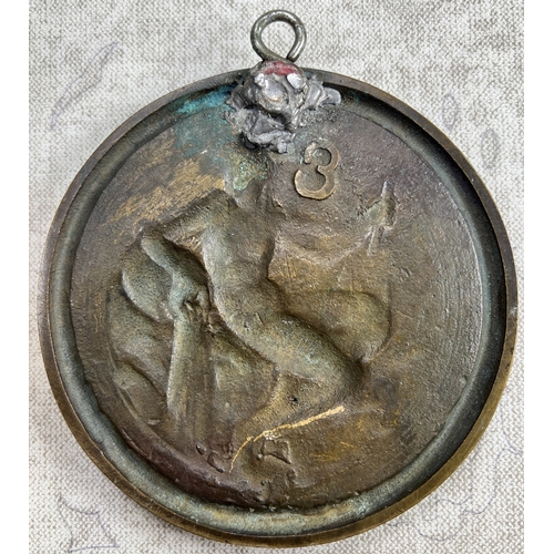 23 - A late 19th /early 20th century bronze plaque depicting a bird on a branch in relief with berries an... 