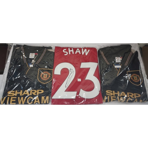 244A - 3 Manchester United retro signed shirts inc. a 1993-95 Away shirt signed by Denis Irwin; another 93-... 