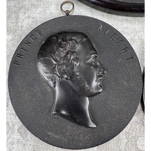 25 - Victoria and Albert portrait plaques in bois durci, diameter 11cm and a larger bust plaque of side p... 